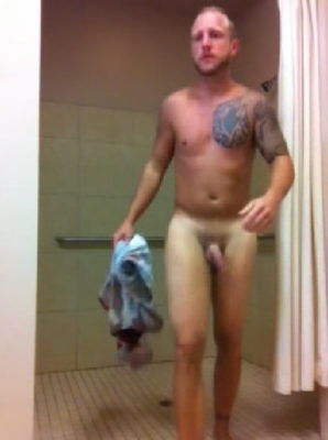 Mature tattoed guy taking a shower