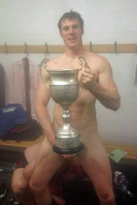 pic1_fit_lithe_footballer_naked_with_cup_in_locker_room_001