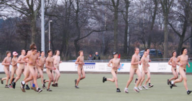 Hockey players naked in field